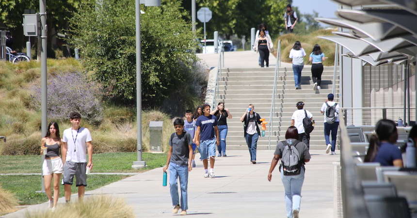 Students walk on campus at UC Merced. <p align=