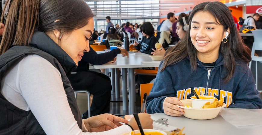 Andrea Ramos and Evelin Esteban enjoy pozole at The Pavilion at UC Merced.