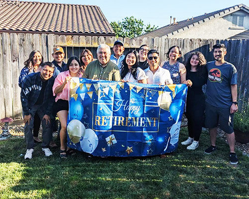 Delgadillo with a group of UC Merced alumni who he served during his time on campus.